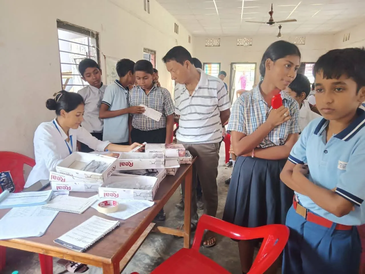 Local community members collaborating at Sivasagar camp.